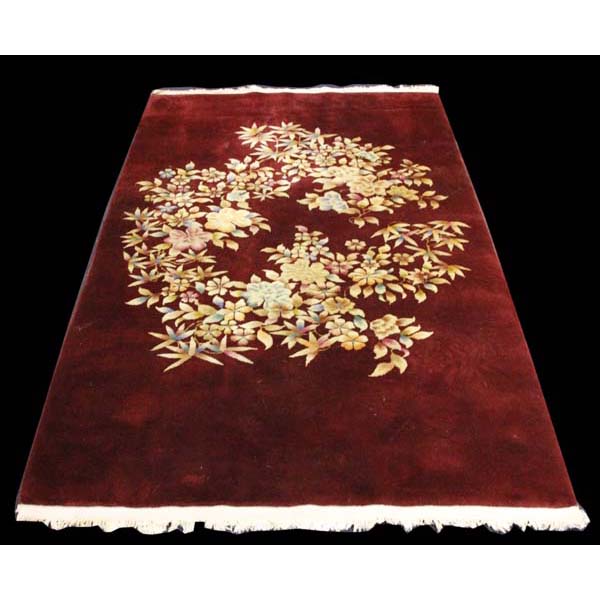 Appraisal: Peking wool area rug x burgundy with florals ' x