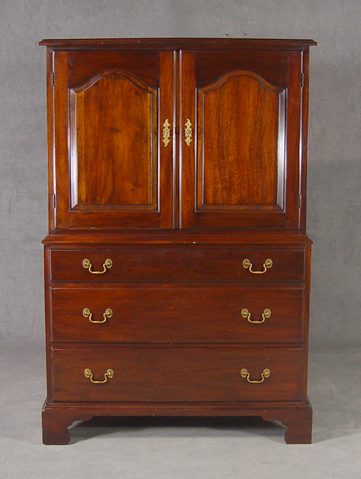 Appraisal: Henkel Harris Mahogany Linen Press Two arched paneled doors concealing