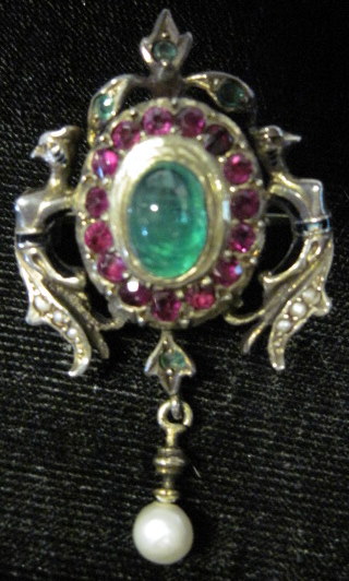 Appraisal: Gold emerald ruby and pearl brooch Oval cabochon emerald framed