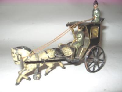 Appraisal: A French hansom cab tinplate clockwork operated with horse driver