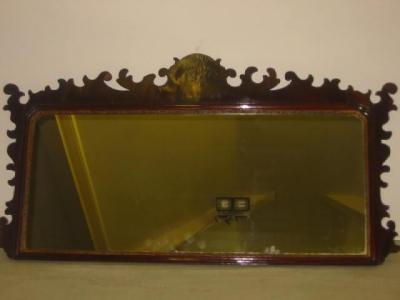 Appraisal: A MAHOGANY FRET FRAMED OVERMANTEL MIRROR the arched oblong plate