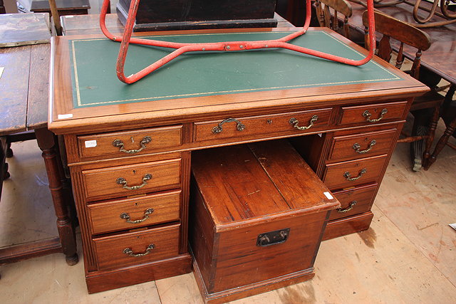 Appraisal: A MAHOGANY PEDESTAL DESK with green leather inset top cm