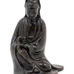 Appraisal: A Chinese Bronze Figure of Guanyin the figure cast seated