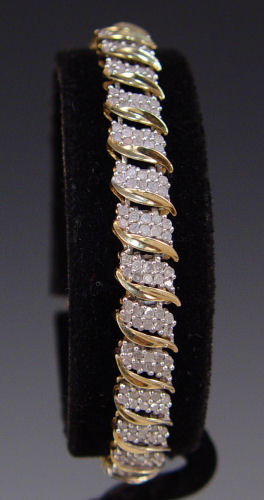 Appraisal: CTW DIAMOND LINE BRACELET K yellow gold bracelet contains round