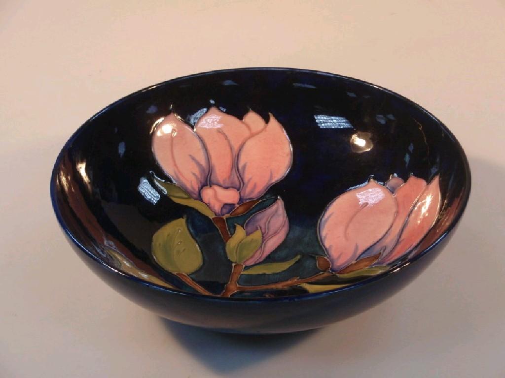 Appraisal: A Moorcroft circular bowl with flowering magnolia decoration on a