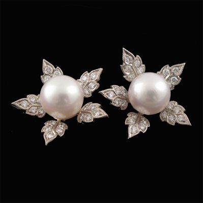 Appraisal: A pair of cultured pearl and diamond flower head earrings