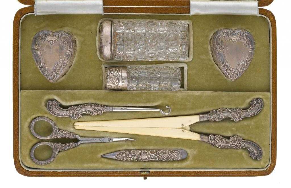 Appraisal: A VICTORIAN SILVER-MOUNTED DRESSING SET comprising pair of heart shaped