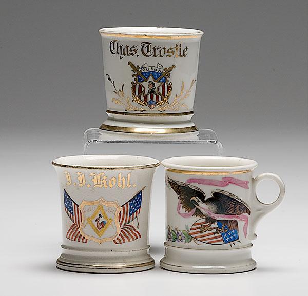 Appraisal: THREE PATRIOTIC SHAVING MUGS lot of two porcelain shaving mugs