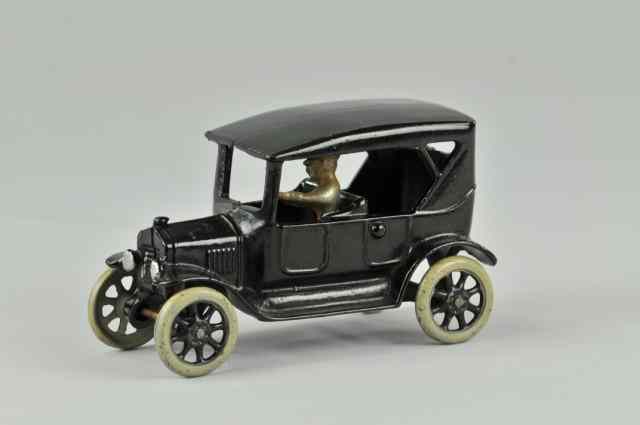 Appraisal: FORD TOURING SEDAN Arcade cast iron painted in black overall