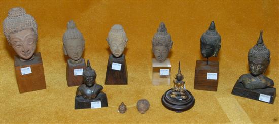 Appraisal: GROUP OF TEN ANTIQUE BRONZE AND STONE BUDDHA HEAD FRAGMENTS