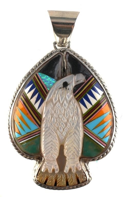 Appraisal: NATIVE AMER STYLE MOSAIC PENDANTSterling silver and carved mother of