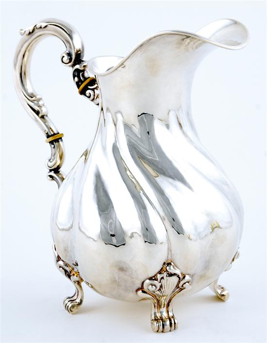 Appraisal: German silver water pitcher swirled pear-form body fitted with C-scroll