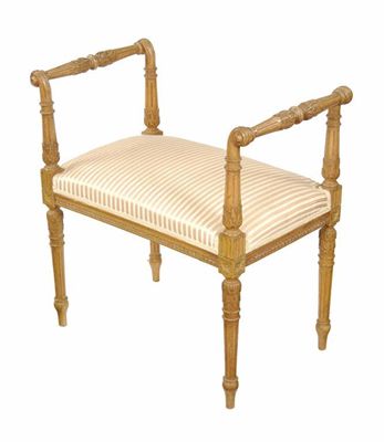 Appraisal: A carved stool upholstered striped fabric with leaf carved fluted