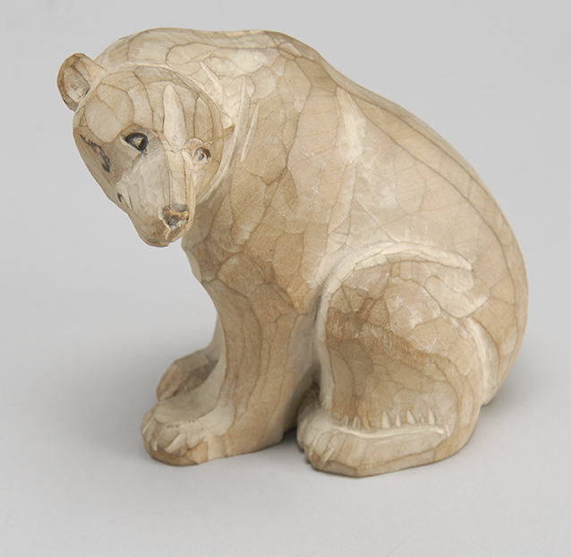 Appraisal: CHIP-CARVED WOODEN FIGURE OF A SEATED POLAR BEAR Late th