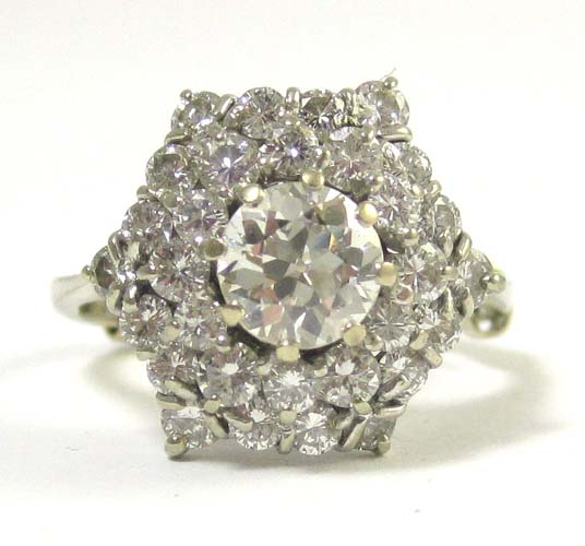 Appraisal: DIAMOND AND EIGHTEEN KARAT WHITE GOLD RING with round brilliant-cut