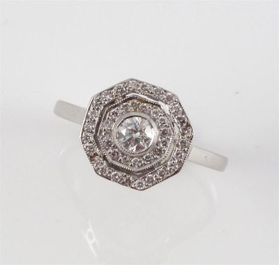 Appraisal: A diamond cluster ring The circular cut centre diamond is