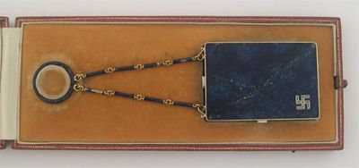 Appraisal: A gold menaudiere by Janesich enamelled to imitate lapiz lazuli