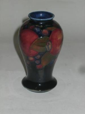 Appraisal: A MOORCROFT POTTERY MINIATURE VASE of baluster form tube lined