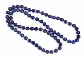 Appraisal: A mm diameter lapis lazuli bead necklace with eighteen ct