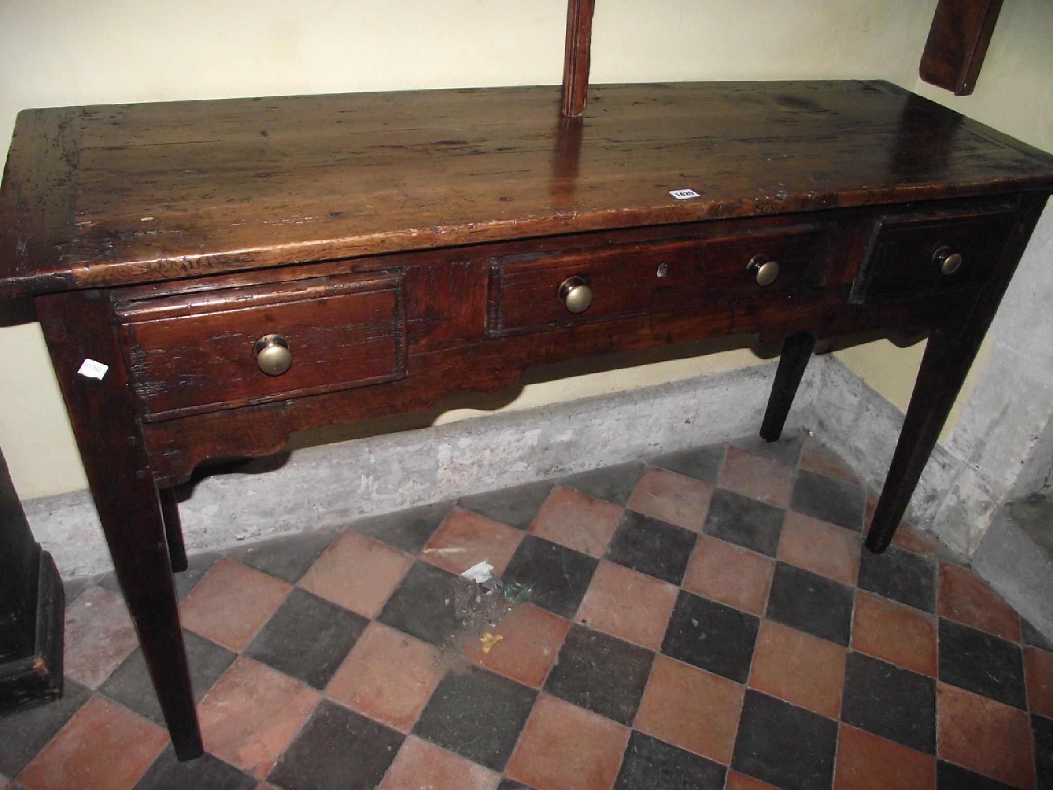 Appraisal: A country made stained pine kitchen side serving table fitted