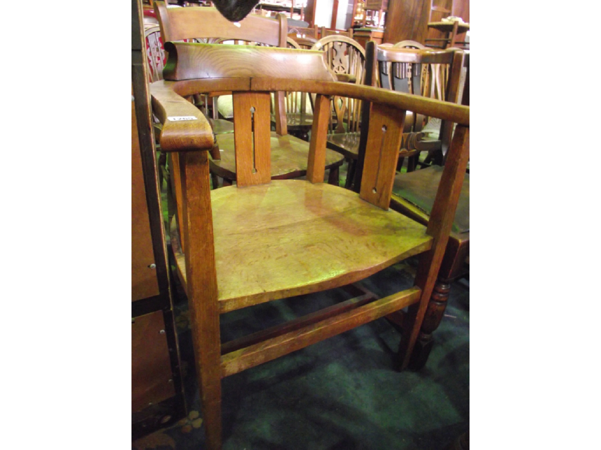 Appraisal: An Art Deco oak office chair with pierced splats saddle