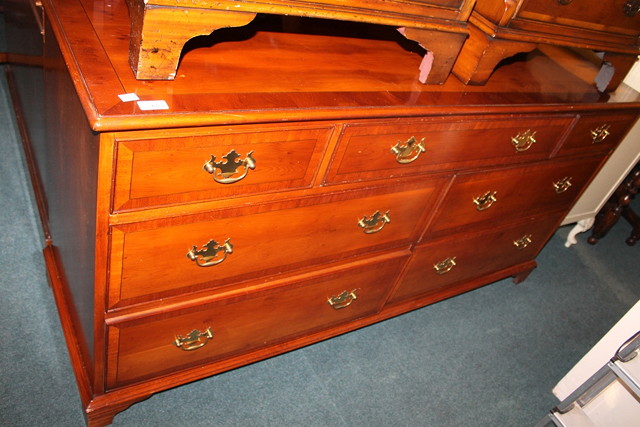 Appraisal: A REPRODUCTION YEW WOOD SIDE CABINET with seven fitted drawers