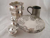 Appraisal: Silver plate A pepper a mustard a pierced tazza and