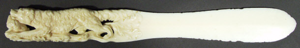 Appraisal: Bone paper knife the handle carved with a hunting dog