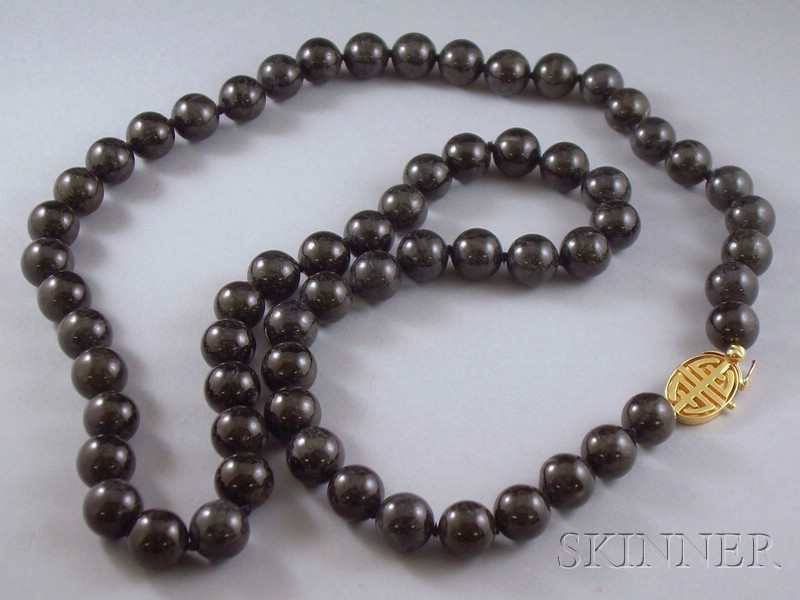 Appraisal: Black Jade Bead Necklace Gump's kt gold clasp lg in