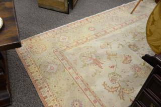 Appraisal: Oriental Oushak room size carpet late th century stains '