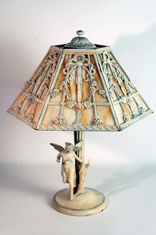 Appraisal: Table lamp with caramel slag glass shade Base with figure