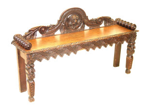 Appraisal: A Victorian carved oak hall bench the raised scrolled back