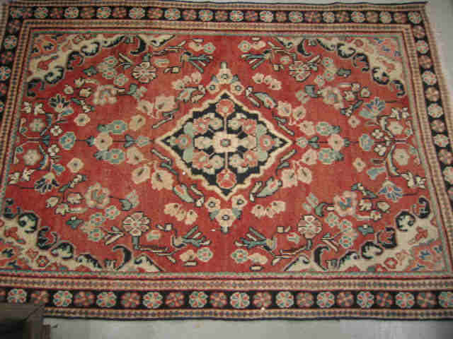 Appraisal: Mahal Persian Handmade Rug central medallion floral trim salmon field