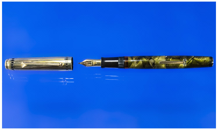 Appraisal: An Eversharp Lever Filling Pen in Lined Green and Black