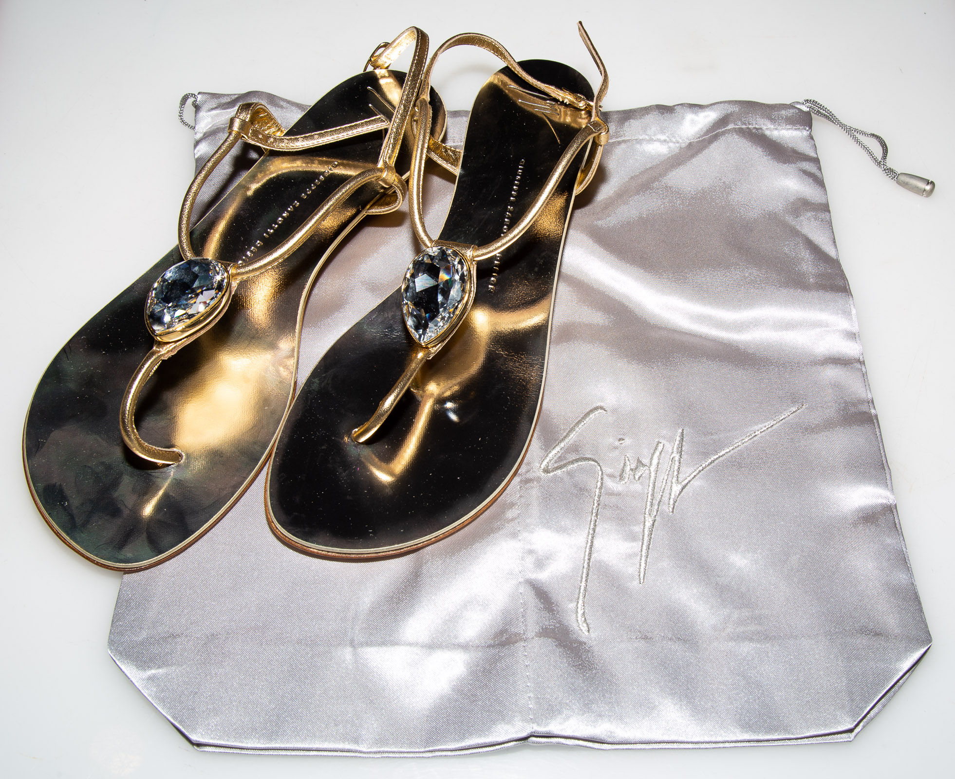 Appraisal: PAIR GIUSEPPE ZANOTTI GOLD LEATHER SANDALS Italian size new in