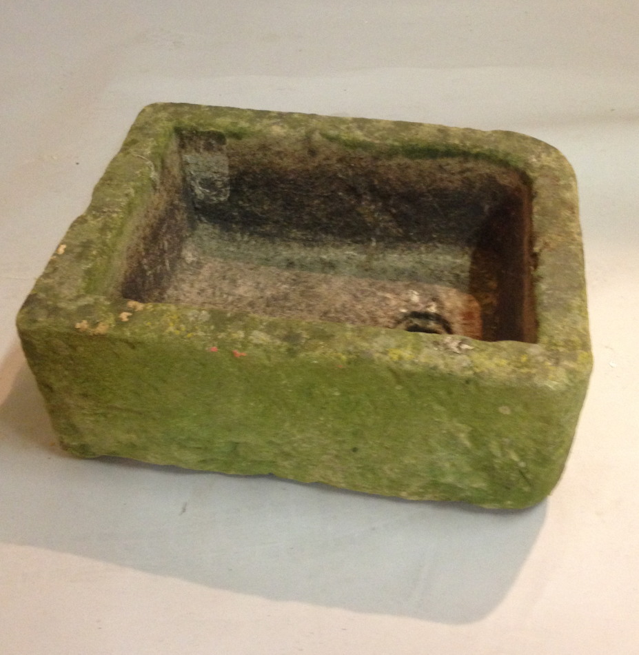 Appraisal: A hewn stone sink of rectangular form