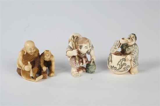 Appraisal: THREE NETSUKES Japanese th century ivory Ebisu and a man