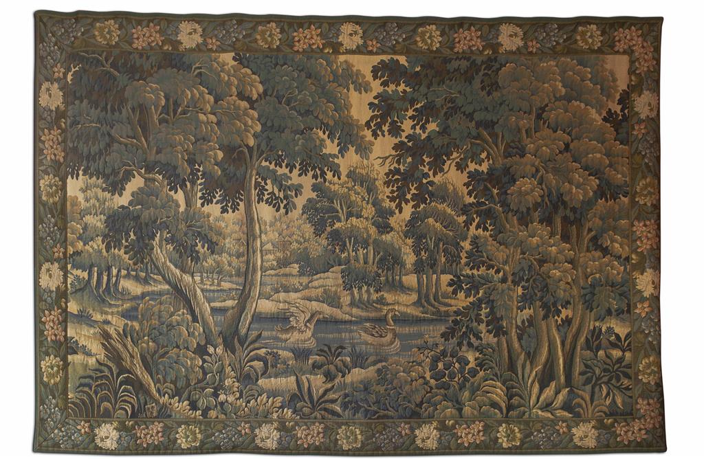 Appraisal: MACHINE WOVEN VERDURE TAPESTRY in the th century style depicting