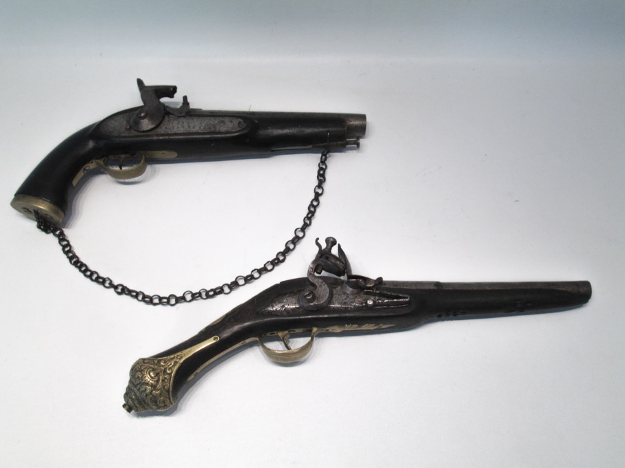 Appraisal: TWO DECORATIVE REPRODUCTION PISTOLS the first a English percussion type