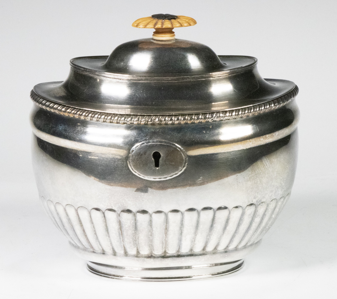 Appraisal: ENGLISH SILVER-PLATE TEA CADDY Oval Neoclassical Style Silver on Copper