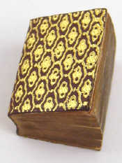 Appraisal: A miniature Qur'an approx x mm in satin pouch