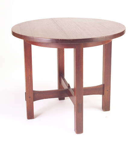 Appraisal: GUSTAV STICKLEY Occasional table with circular top and stacked arched