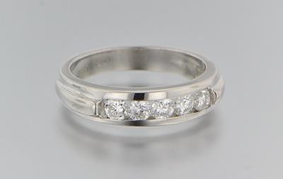 Appraisal: A Platinum and Diamond Ring Platinum ring features five channel