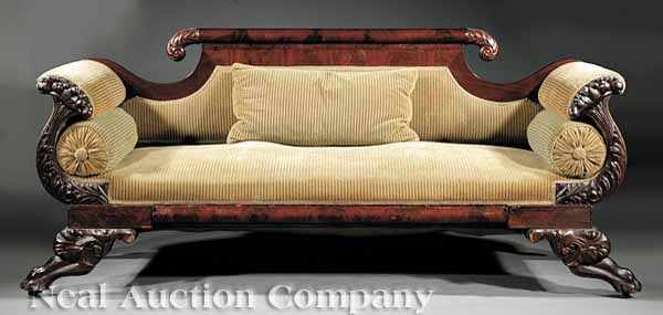 Appraisal: An American Classical Carved Mahogany Sofa th c rounded crest