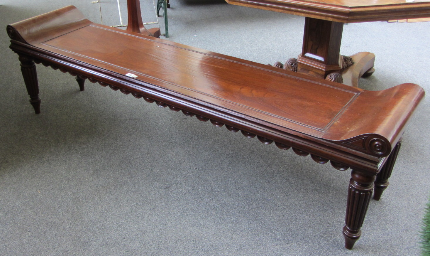 Appraisal: An George III style teak hall bench with scroll ends