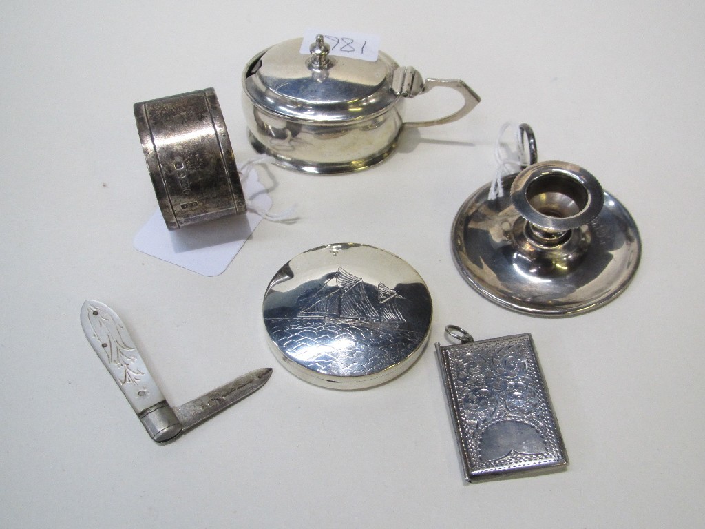 Appraisal: Lot comprising sterling silver stamp case candleholder fruit knife napkin