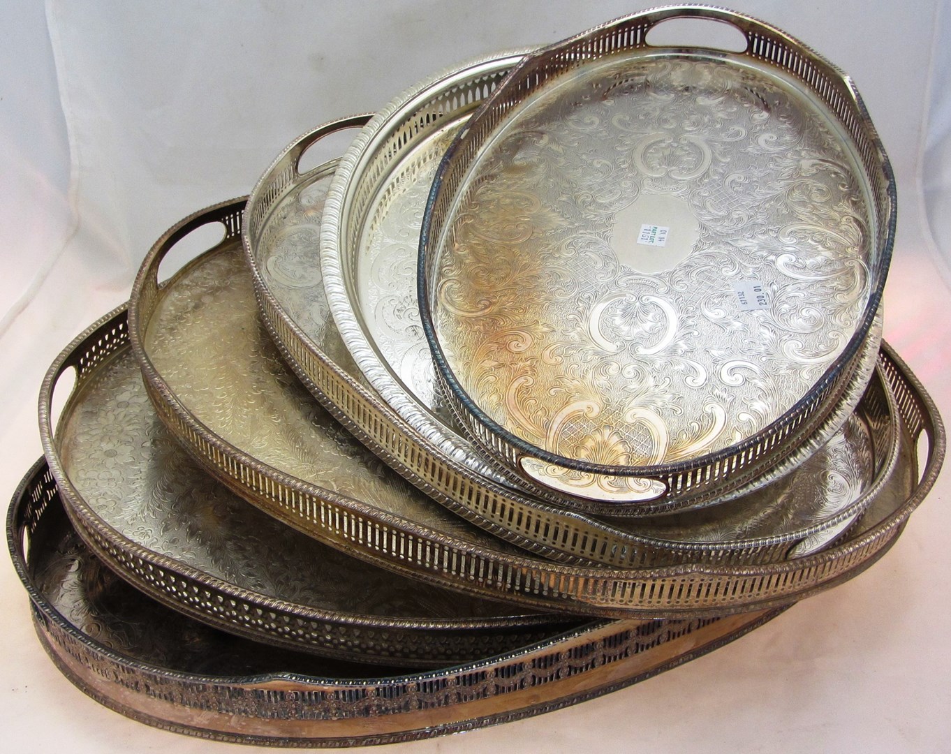 Appraisal: An oval twin handled plated gallery tray a pair of