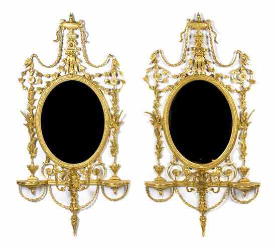 Appraisal: A Pair of Adam Style Giltwood Mirrors each having an