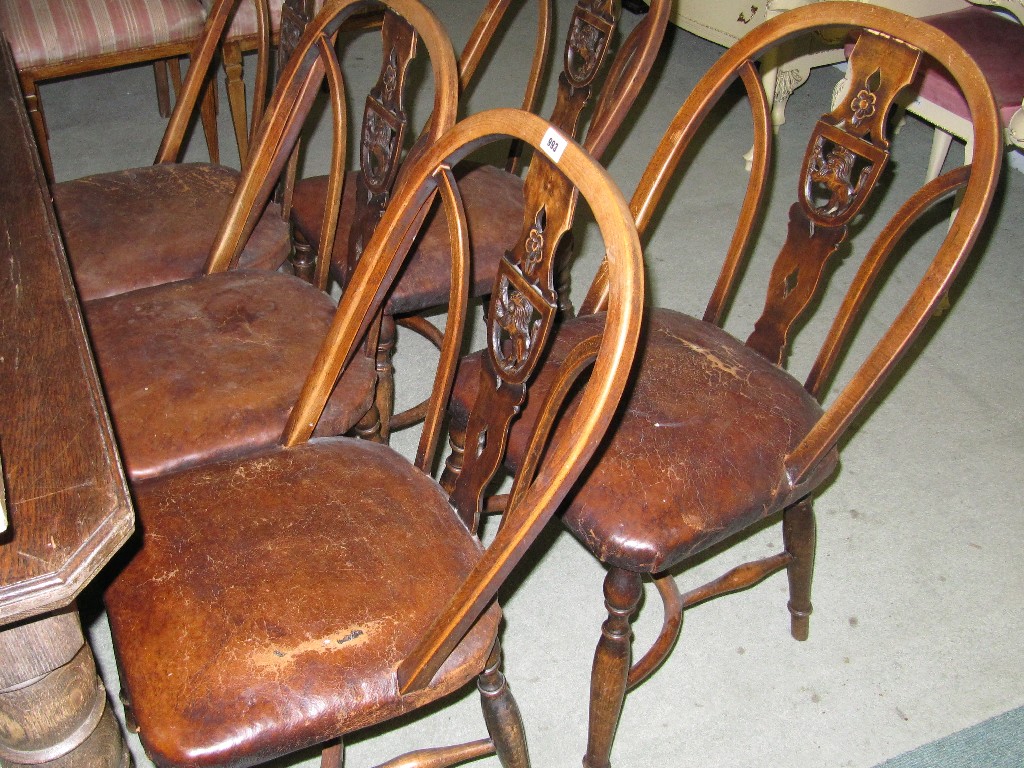 Appraisal: Set of five dining chairs with carved lion splats