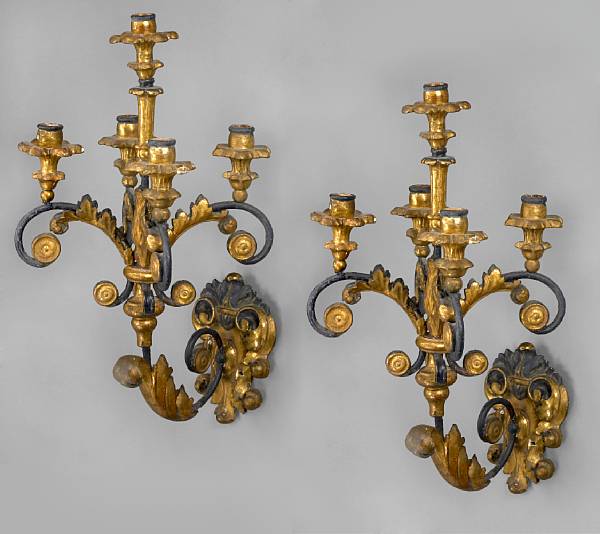 Appraisal: A pair of Italian carved giltwood and wrought metal five